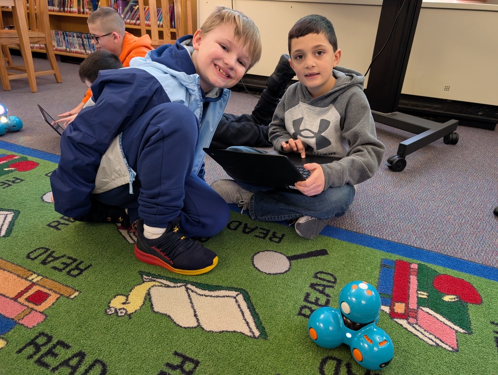 Pairings of students participating in a Robotics activity with Dash and Dot Robots. Each photo has two students and the laptop they're using to  program the robots. 
