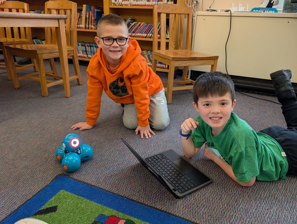 Pairings of students participating in a Robotics activity with Dash and Dot Robots. Each photo has two students and the laptop they're using to  program the robots. 