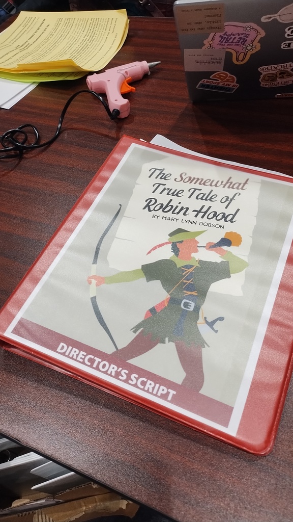 The Director's Script for "The Somewhat True Tale of Robin Hood"- It depicts Robin Hood holding a horn, and a bow and arrow on the cover