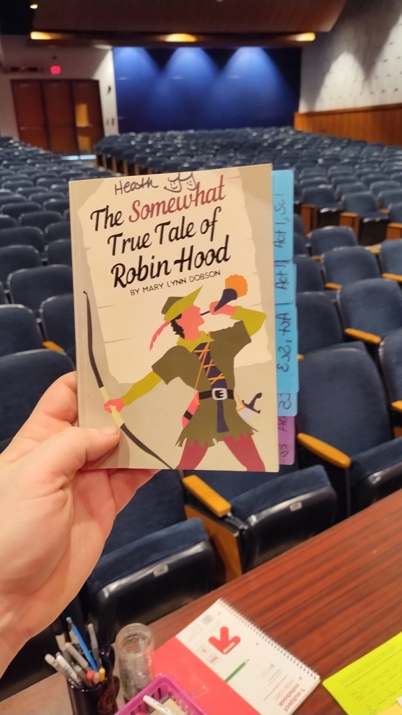 The Director's Script for "The Somewhat True Tale of Robin Hood"- It depicts Robin Hood holding a horn, and a bow and arrow on the cover