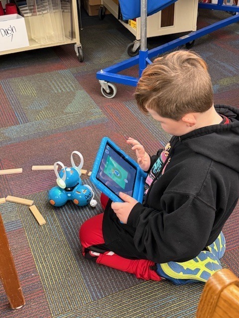 McConnellsville Coding Club Students Working On A Robotics Easter Egg Hunt In The Library