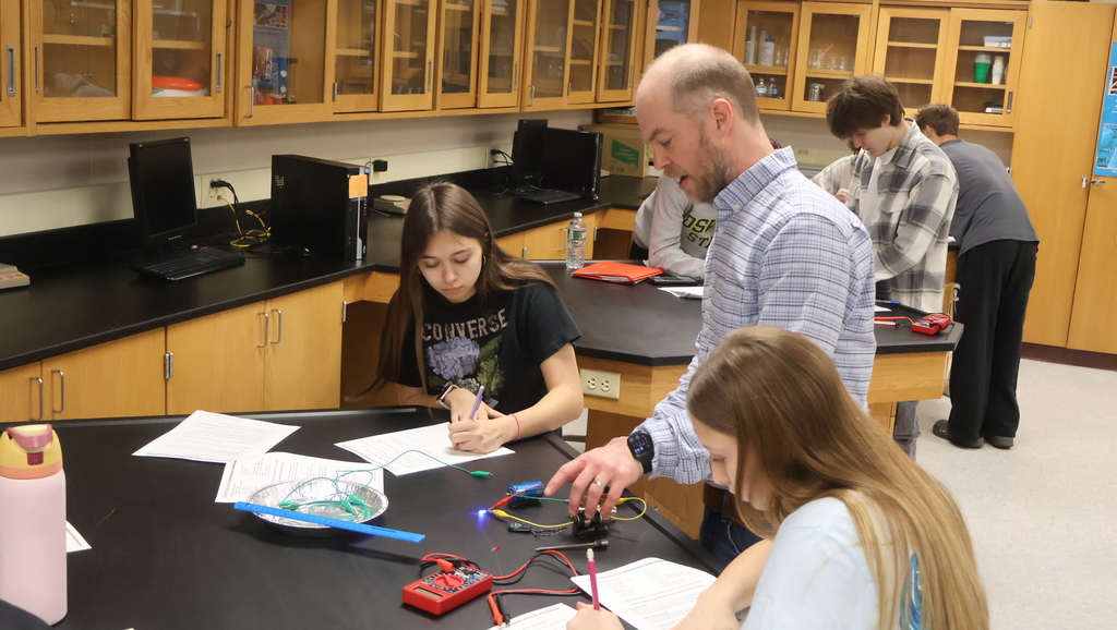 Mr. Scholz's students completing their electromagnetic lab in physics class