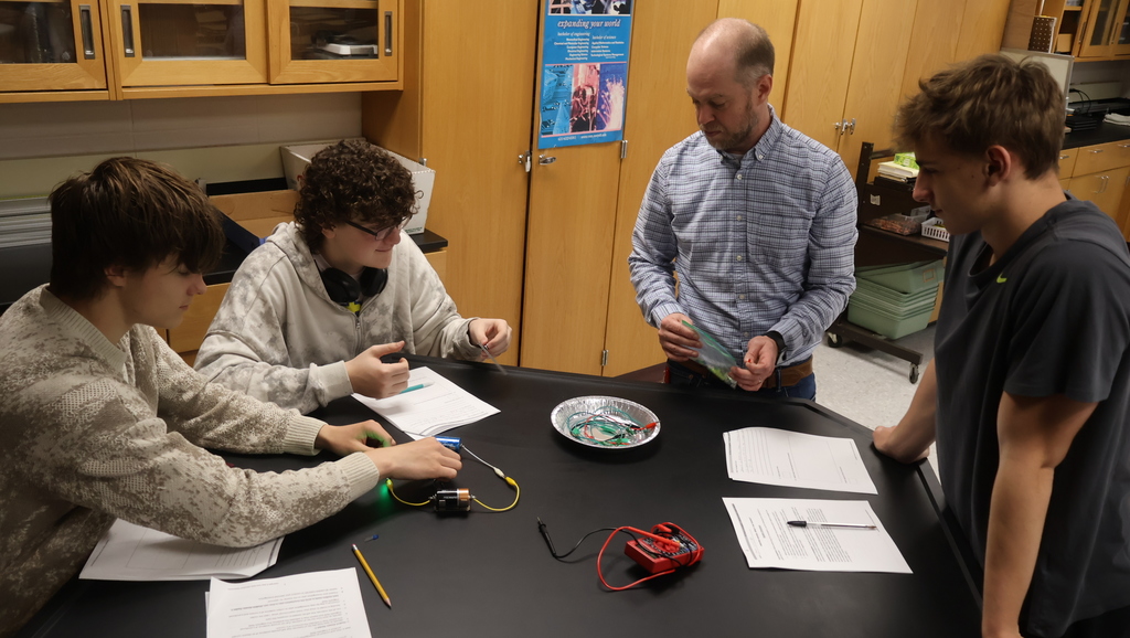 Mr. Scholz's students completing their electromagnetic lab in physics class