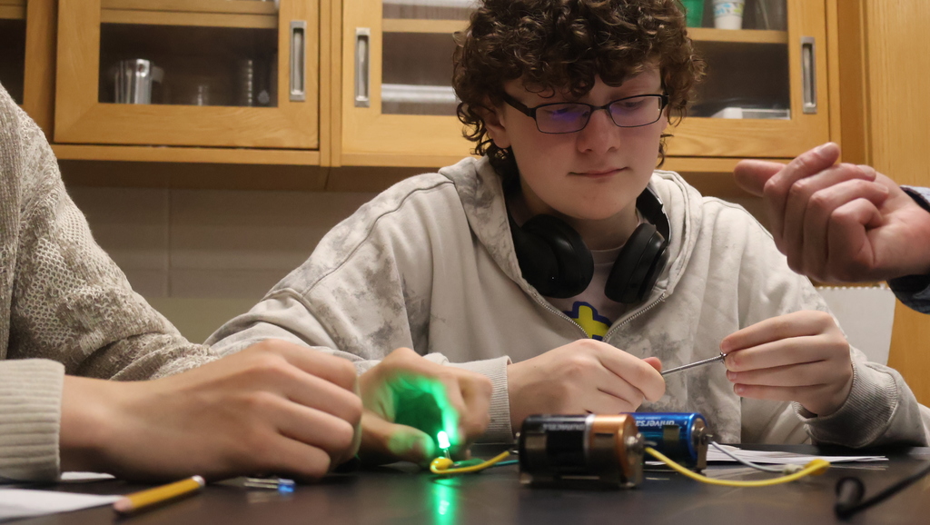 Mr. Scholz's students completing their electromagnetic lab in physics class