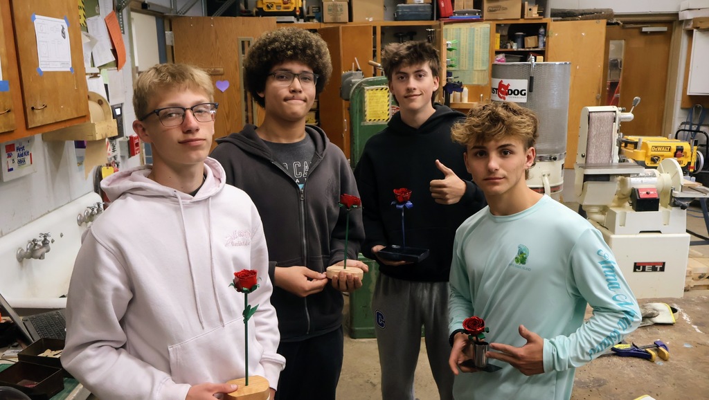 Four students pose with their finished project. 