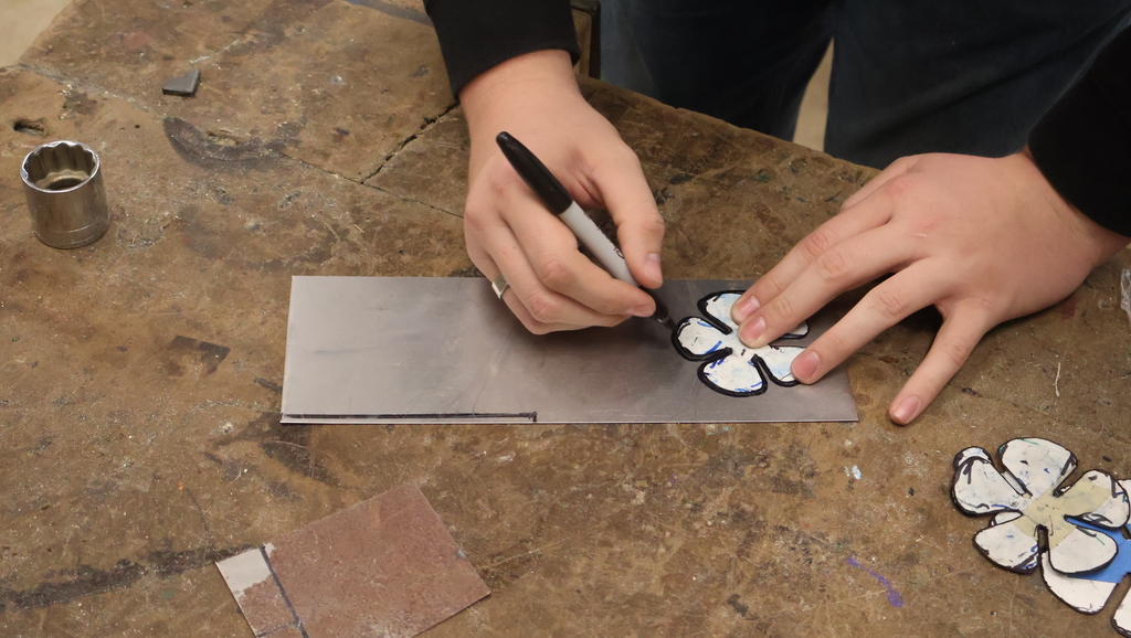 Tracing the petals on sheet steel
