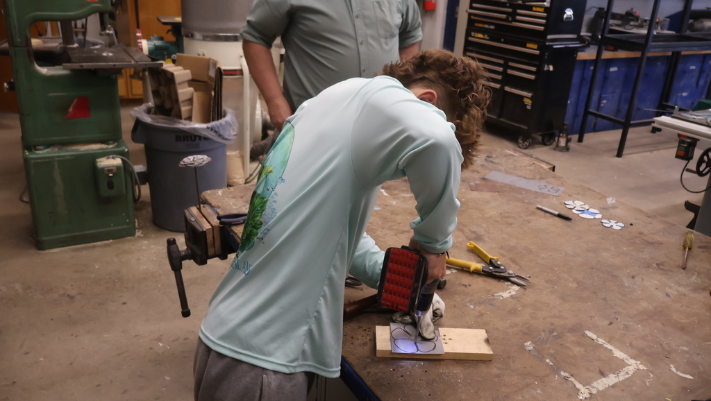tapping and drilling the holes in the metal petal plate