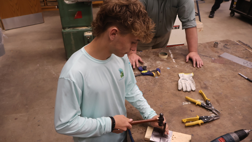tapping and drilling the holes in the metal petal plate