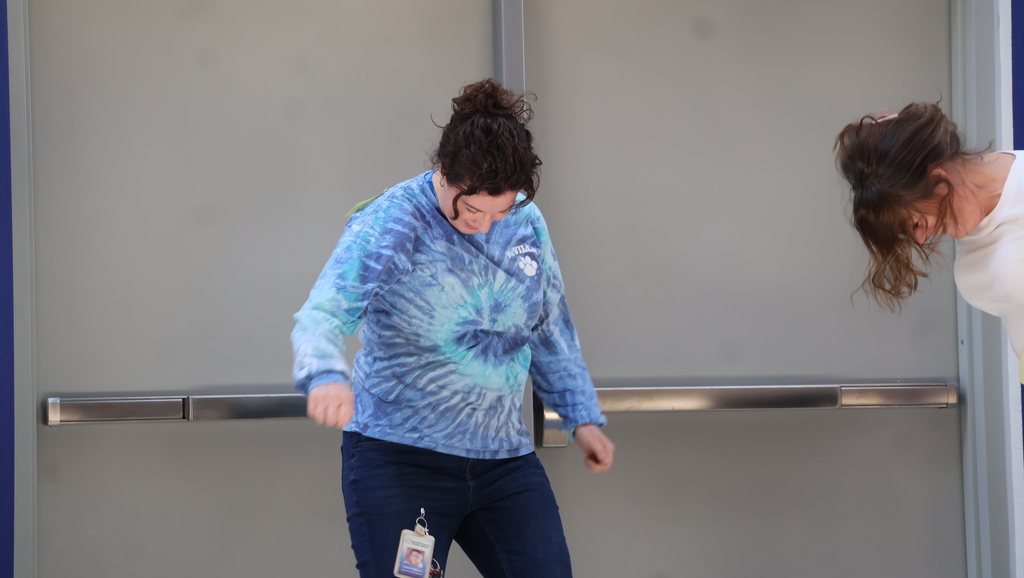 Staff Members Attempting To Shake Off Sticky Notes