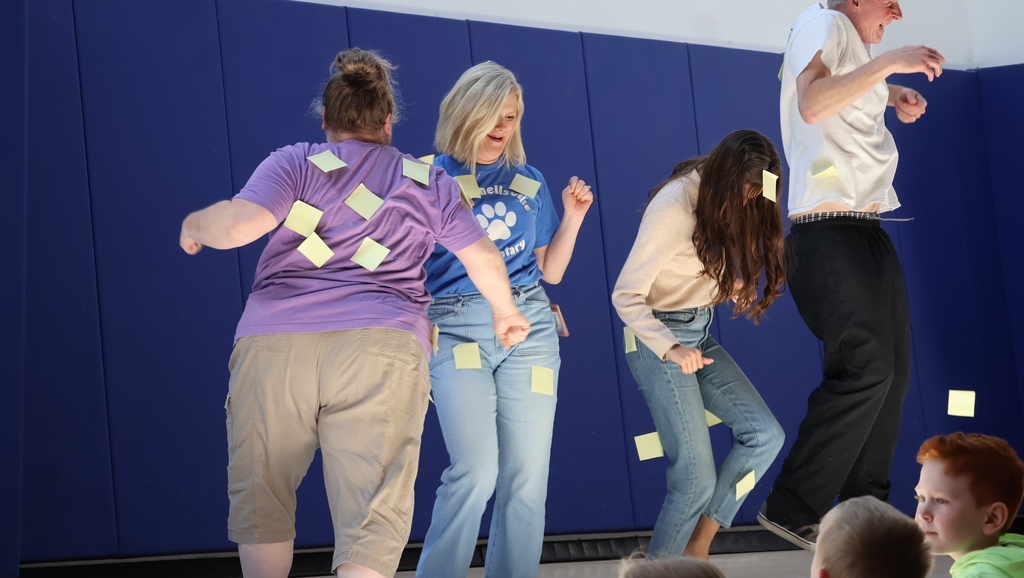 Staff Members Attempting To Shake Off Sticky Notes