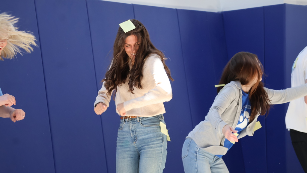 Staff Members Attempting To Shake Off Sticky Notes