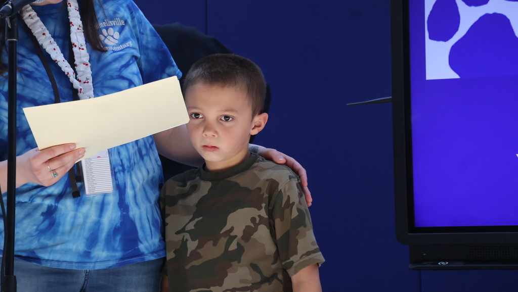 Student Receiving His Character Award Certificate