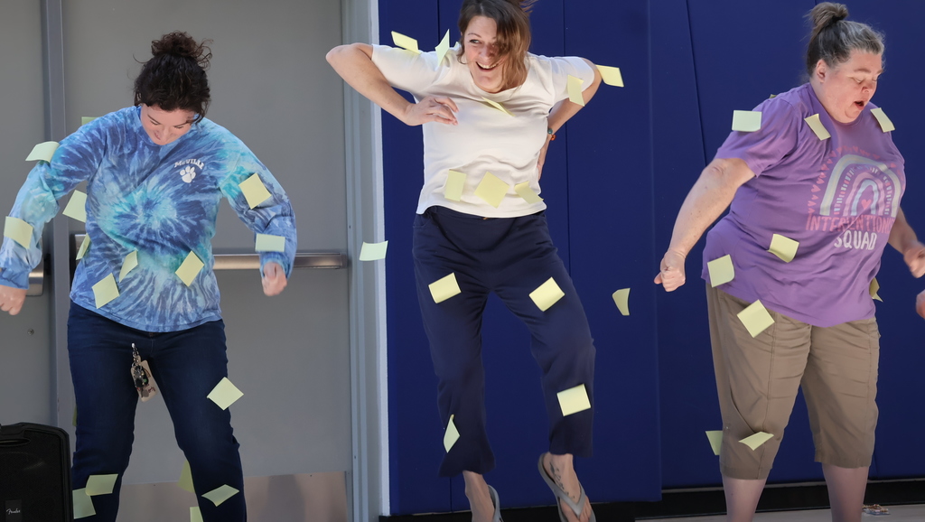 Teachers shaking off post-it notes