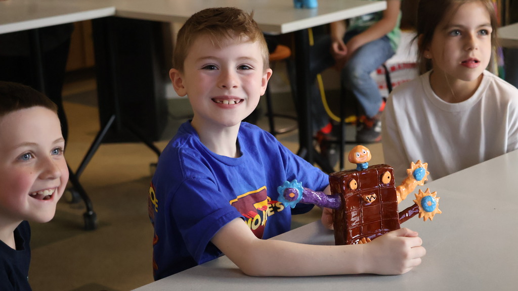 Second Grade Student with His Sculpture