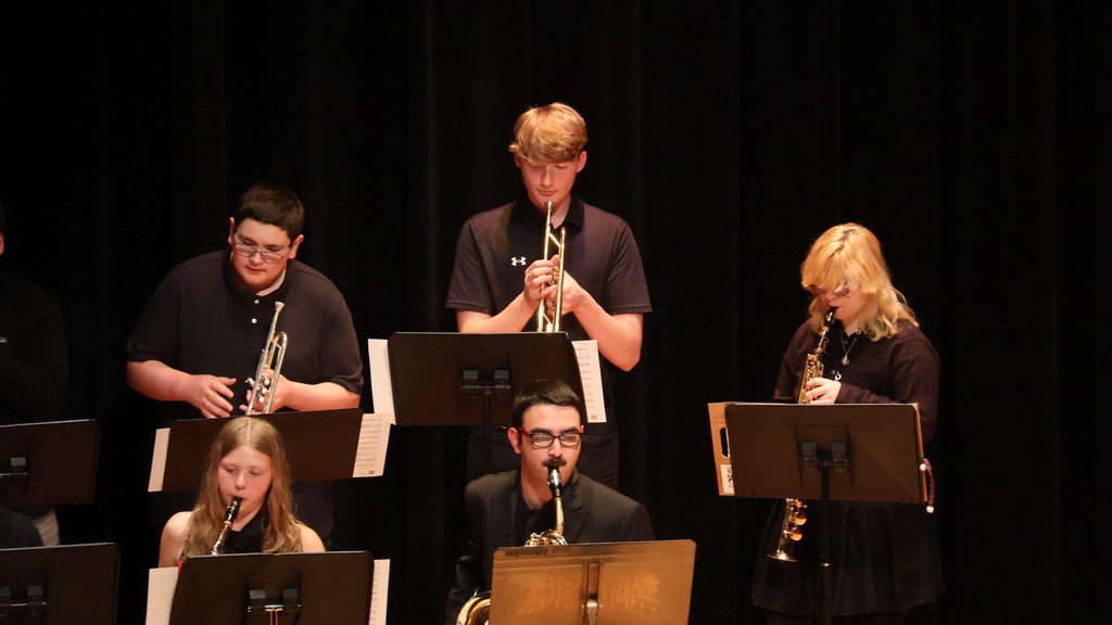 The trumpet section from the CHS Jazz Band, along with members of the Saxophone sections