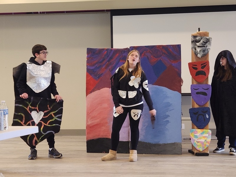 Our protagonists with the totem pole of grief