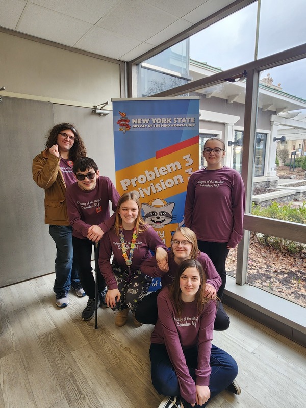 Team Photo At Long-Term Problem Sign