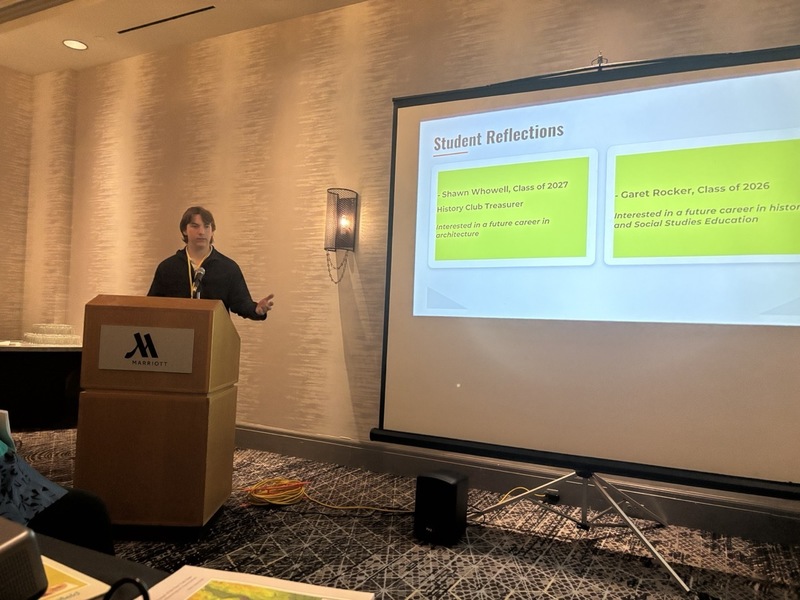 Garet Rocker at the podium