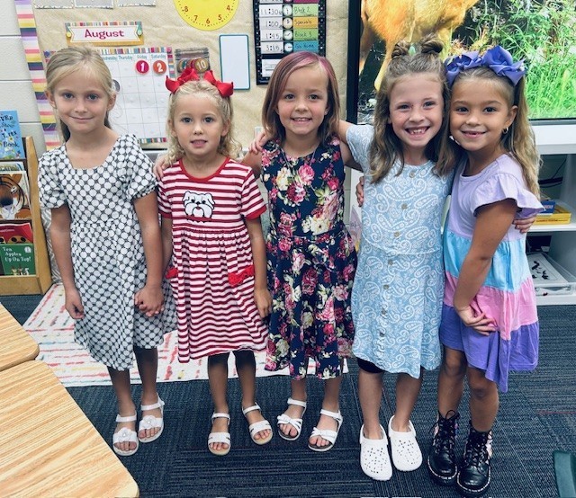 five girls together in a photo at 1st grade