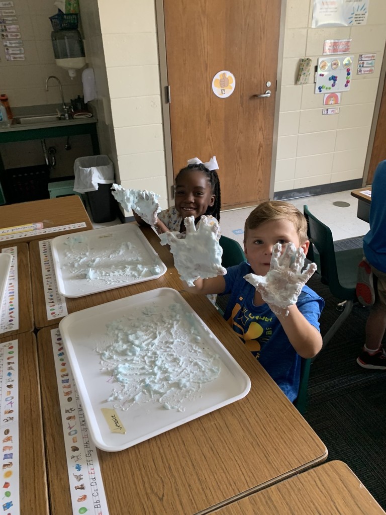 students write using shaving cream