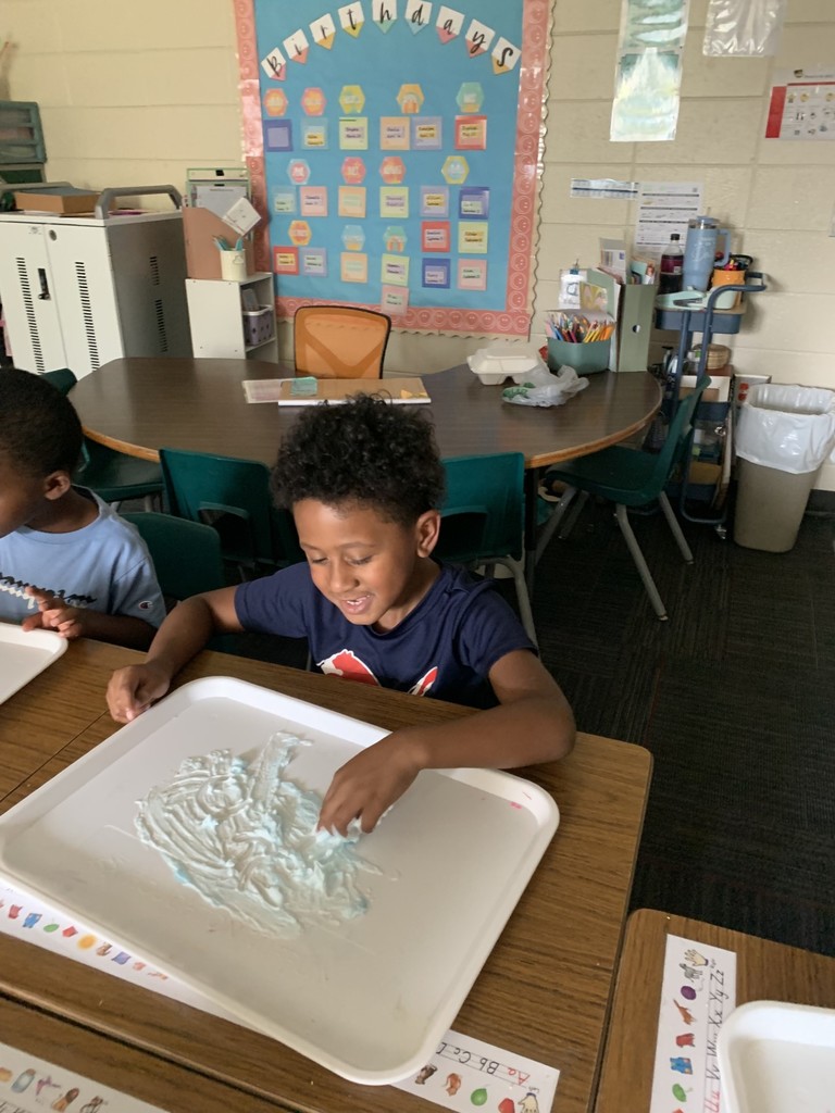 students write using shaving cream