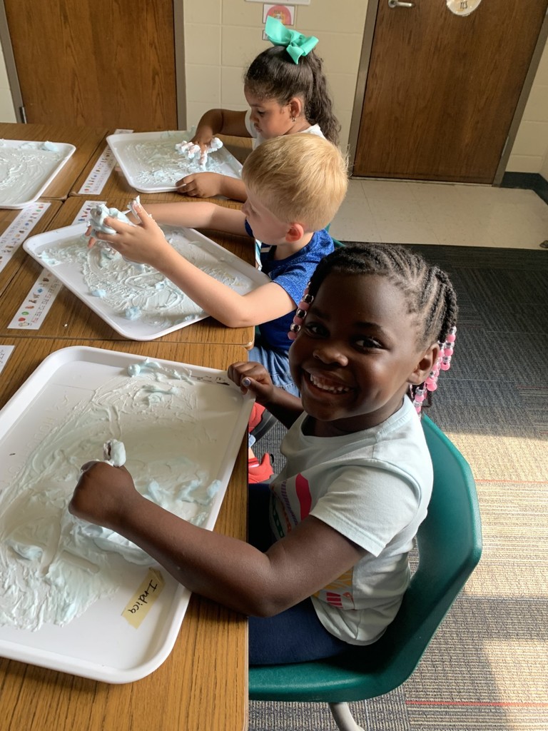 students write using shaving cream