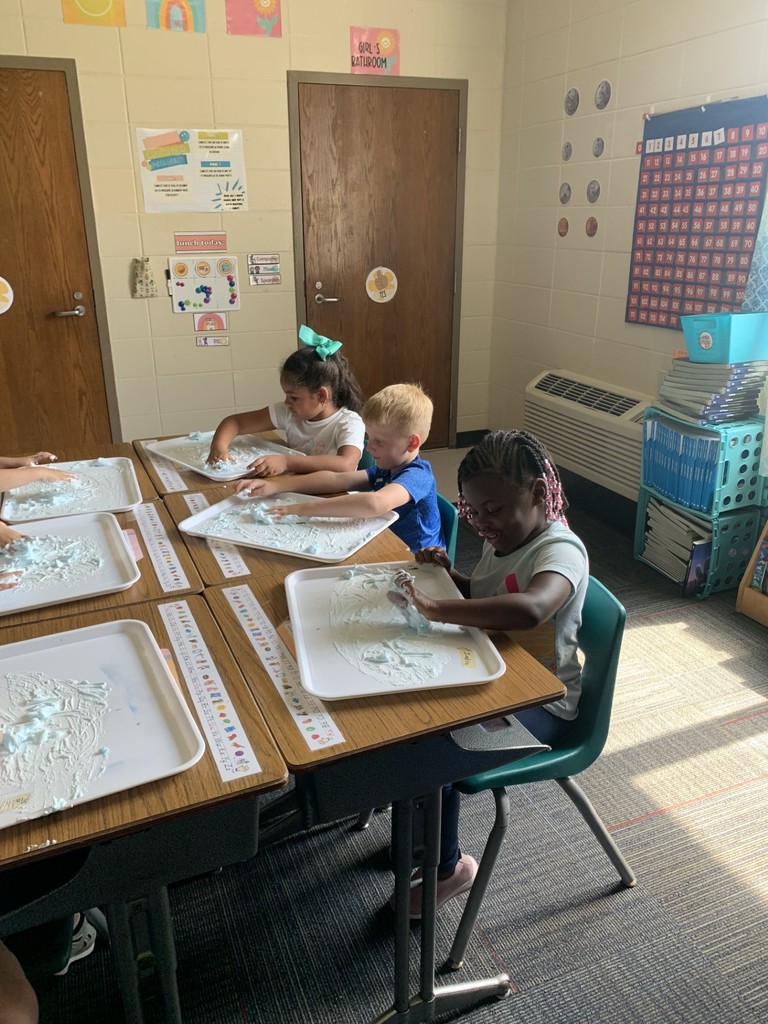 students write using shaving cream
