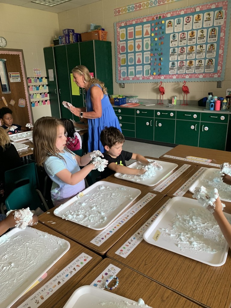 students write using shaving cream