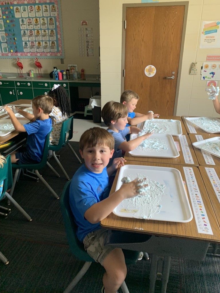 students write using shaving cream