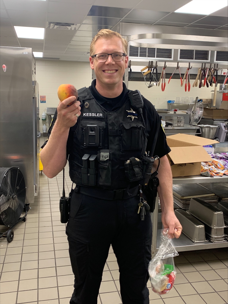Our SRD holding a peach.
