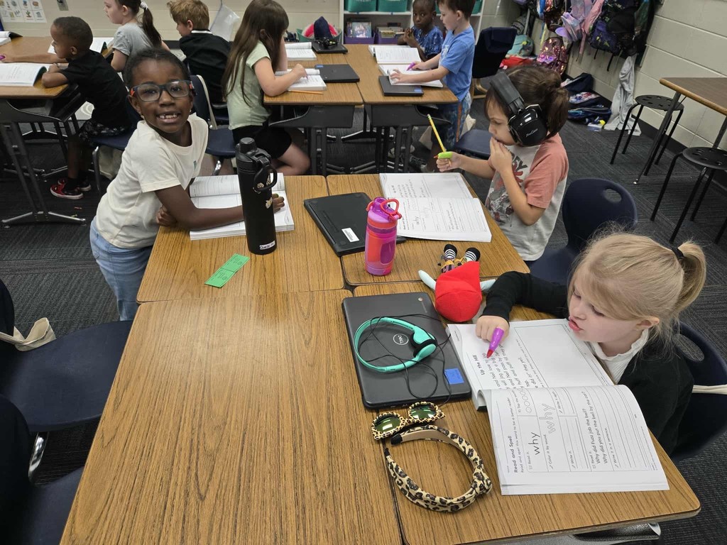 first grade students practice tracking