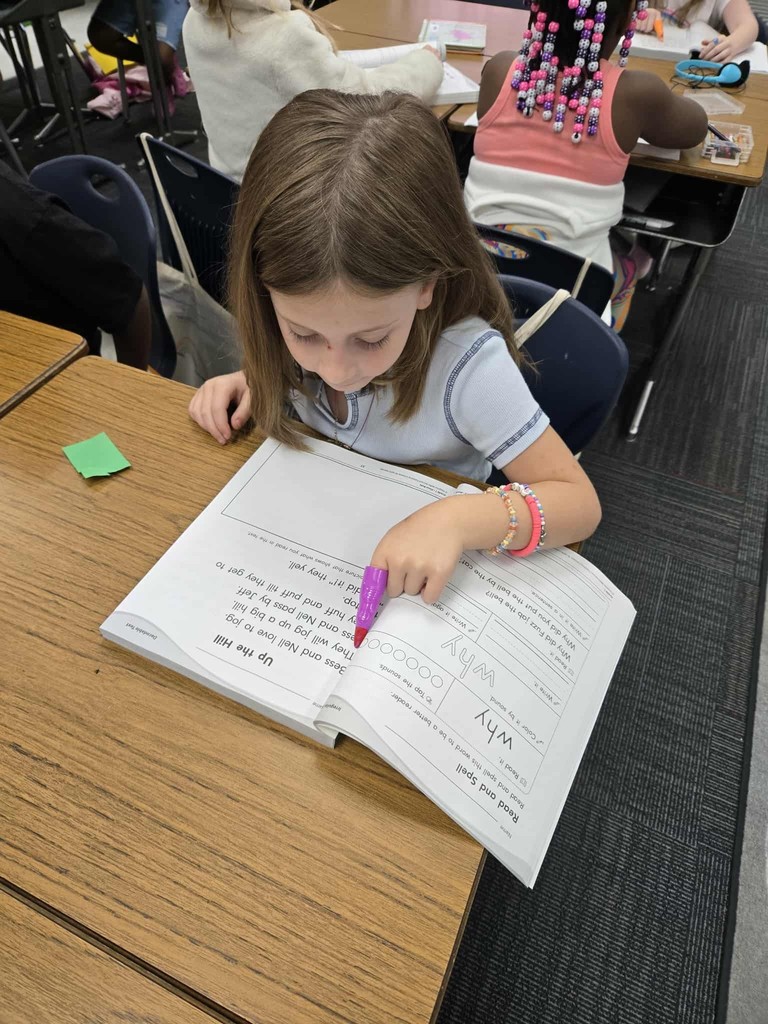 first grade students practice tracking