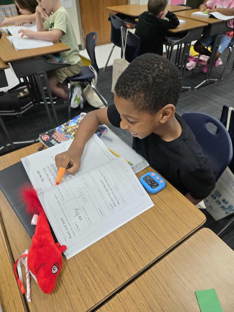 first grade students practice tracking