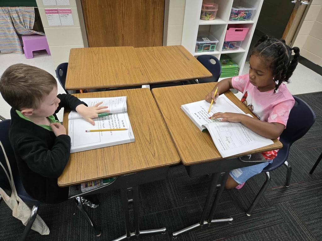 first grade students practice tracking