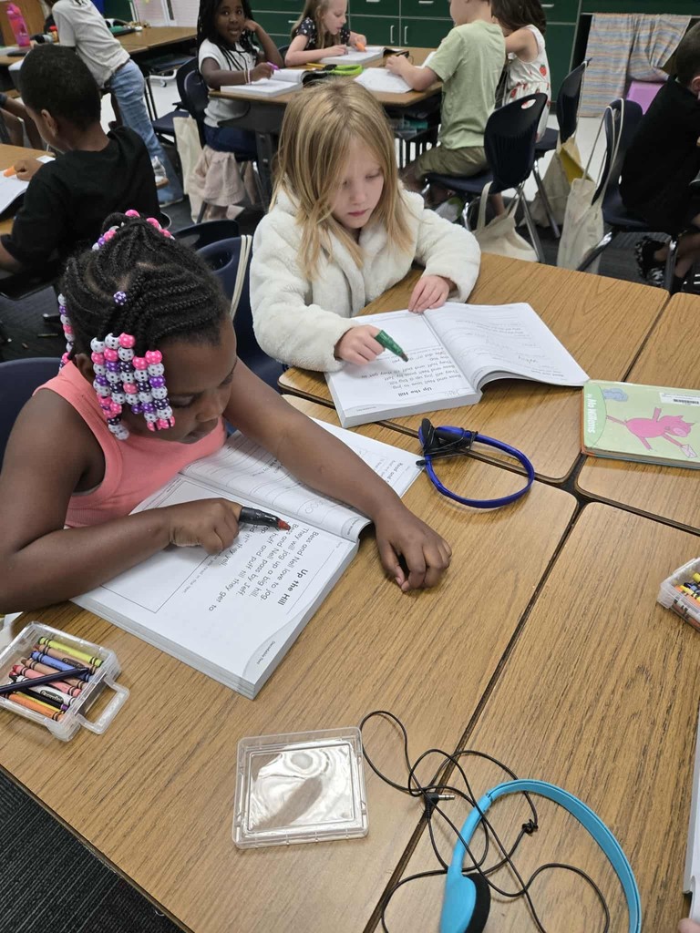 first grade students practice tracking