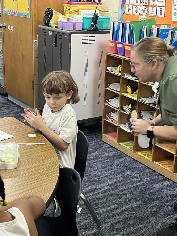 Nurse Kelly showing Kindergarten about hand washing