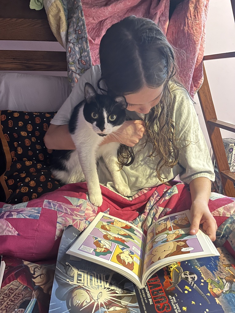 Girl reading to cat