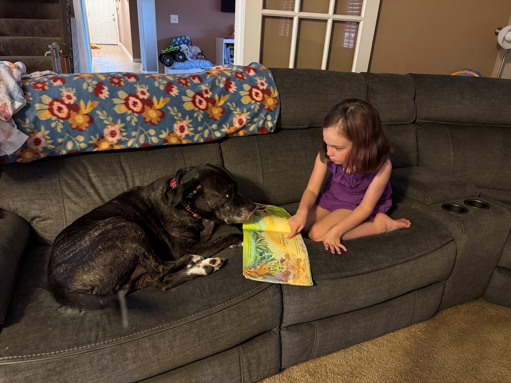 Girl reading to dog
