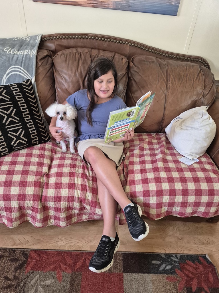 Girl reading to dog