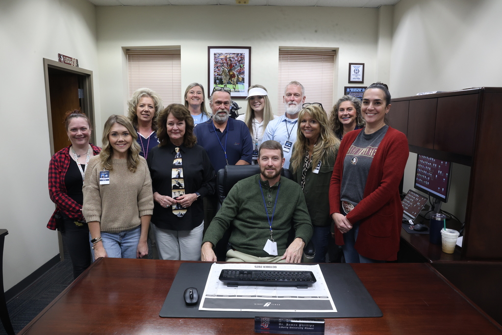 principal posing with look alikes