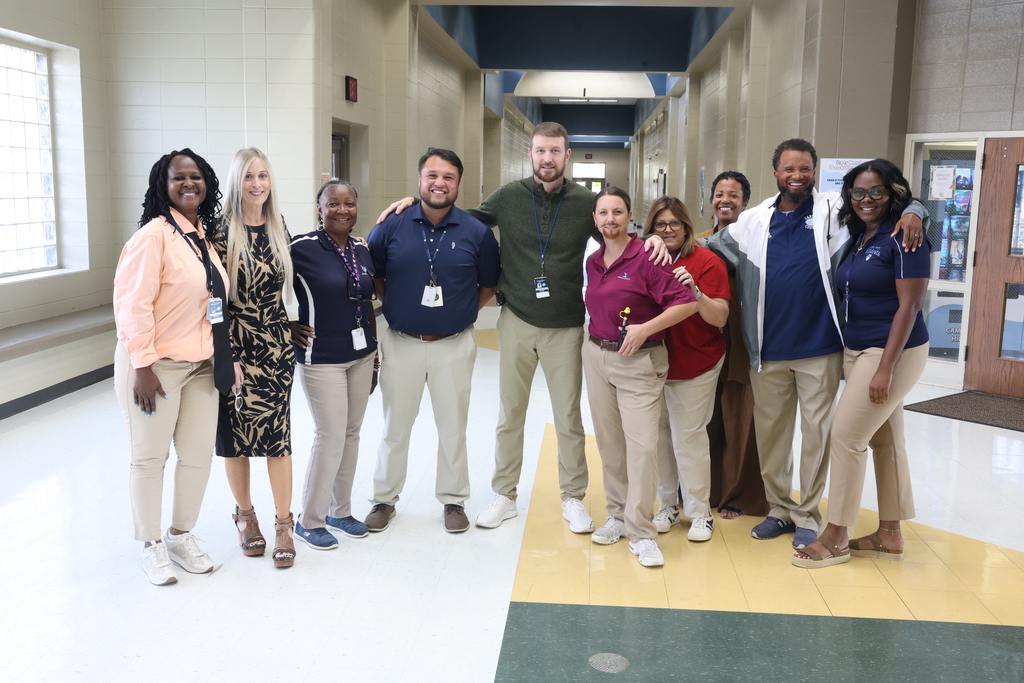 principal posing with look alikes