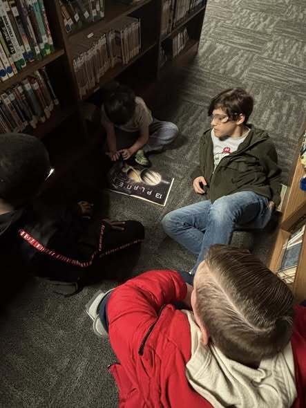 5th graders reading to kindergarteners