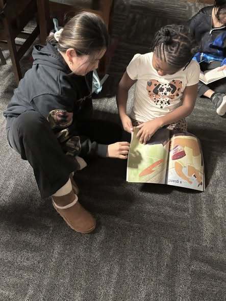 5th graders reading to kindergarteners