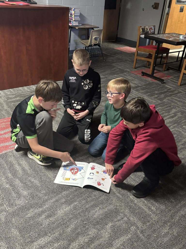 5th graders reading to kindergarteners