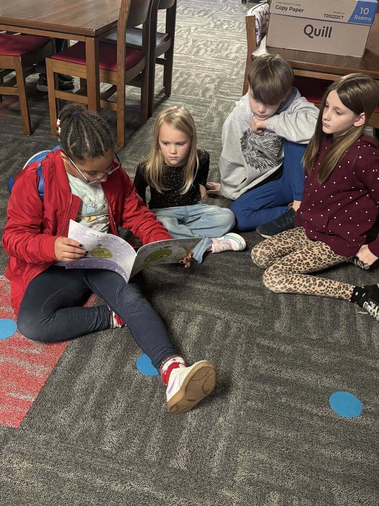 5th graders reading to kindergarteners