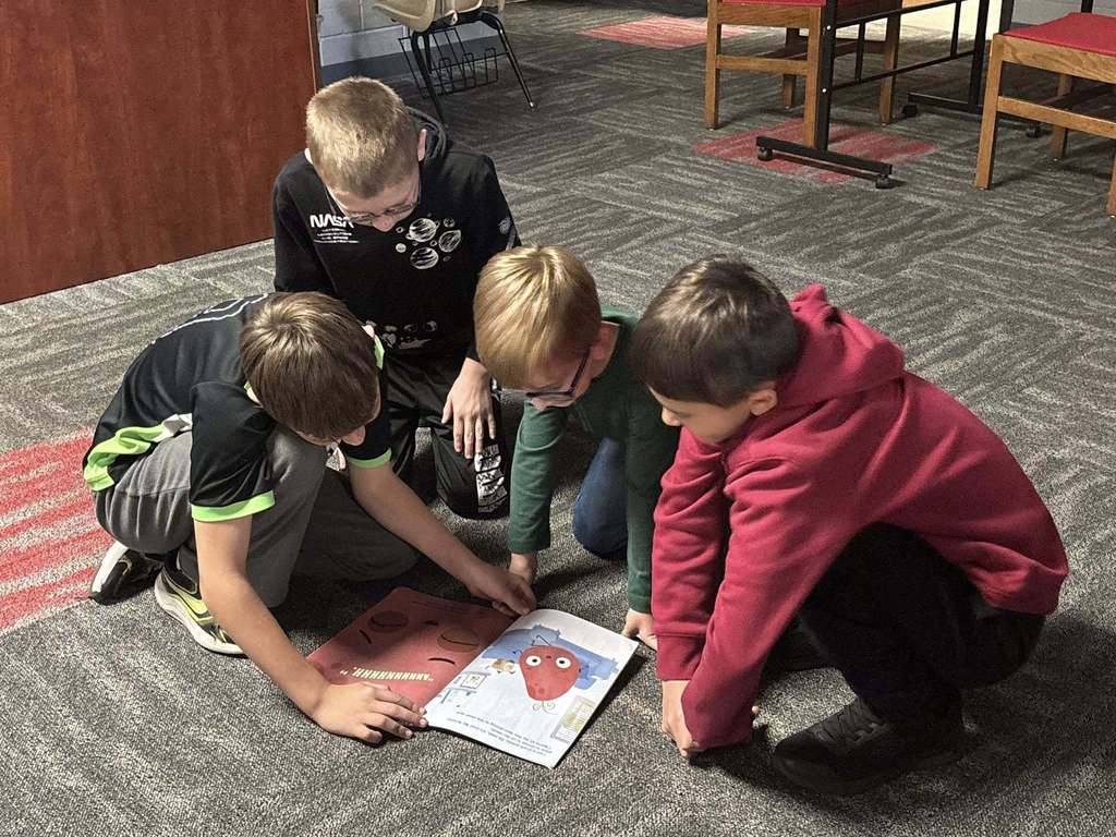 5th graders reading to kindergarteners