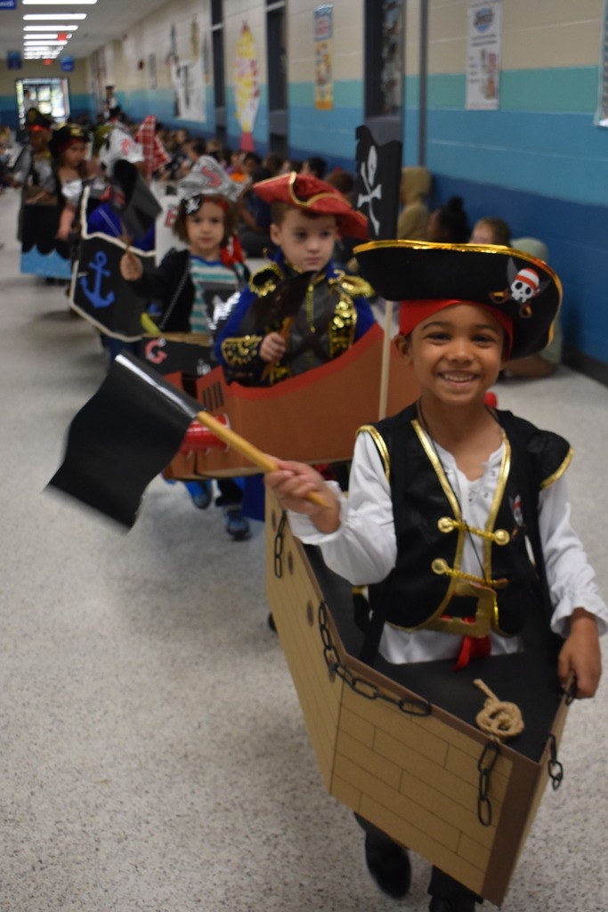 students walking in parade as pirates