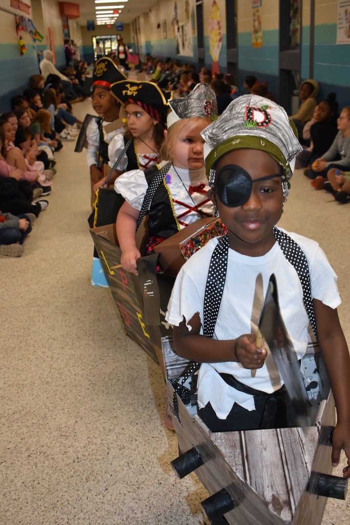 students walking in parade as pirates