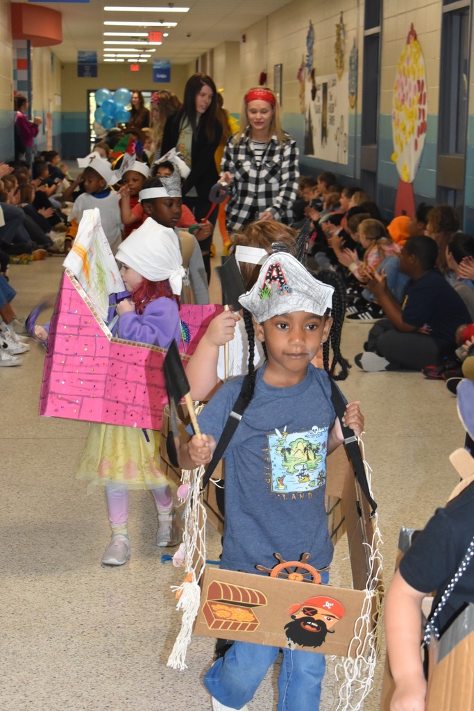 students walking in parade as pirates