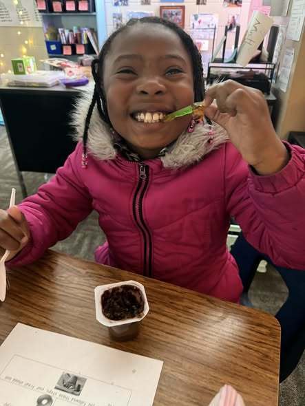 student eating gummy worn